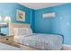 Bright bedroom with two beds, an AC unit, beach-themed decor, and comfortable lighting at 201 S Ocean Blvd. # 217, Myrtle Beach, SC 29577