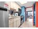 The full kitchen has stainless steel appliances, granite counters, and overlooks the dining and living spaces at 201 S Ocean Blvd. # 217, Myrtle Beach, SC 29577