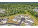 Aerial view of Heather Glen cul-de-sac homes, each with lush landscaping and long driveways, set against a natural backdrop at 205 Kinross Ct., Little River, SC 29566
