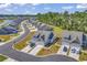 Aerial view showcases the layout of homes, manicured landscaping, and the continuity of design within the Heather Glen community at 205 Kinross Ct., Little River, SC 29566
