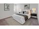 Comfortable bedroom with neutral decor, featuring carpeted floors, large windows, and a comfortable bed at 205 Kinross Ct., Little River, SC 29566