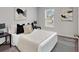 Cozy bedroom with neutral decor, featuring carpeted floors, a large window, and a comfortable bed at 205 Kinross Ct., Little River, SC 29566