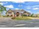 Heather Glen clubhouse with stone accents, features manicured landscaping, and circular drive at 205 Kinross Ct., Little River, SC 29566