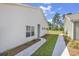 Side of home featuring siding and walkway leading to backyard space at 205 Kinross Ct., Little River, SC 29566