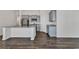 Kitchen boasts an island, stainless steel appliances, granite countertops, gray cabinets and wood flooring at 205 Kinross Ct., Little River, SC 29566