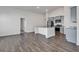 Open-concept kitchen features stainless steel appliances, gray cabinetry, granite countertops and island with a sink at 205 Kinross Ct., Little River, SC 29566