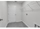 Laundry room includes tile flooring, a hanging rack and washer/dryer hookups at 205 Kinross Ct., Little River, SC 29566