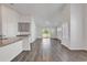 Spacious living room features wood floors and sliding glass doors leading to the backyard at 205 Kinross Ct., Little River, SC 29566