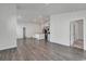 Open concept living area with wood floors leads to a kitchen with gray cabinets and an island at 205 Kinross Ct., Little River, SC 29566