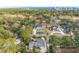 Wide aerial perspective of a home nestled among trees near a golf course with a view of the coastline at 208 Green Lake Dr., Myrtle Beach, SC 29572