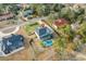 Breathtaking aerial shot showcasing a home with a backyard pool, patio area, and lush green surroundings at 208 Green Lake Dr., Myrtle Beach, SC 29572