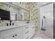 Charming bathroom with double vanity, modern fixtures and designer wallpaper at 208 Green Lake Dr., Myrtle Beach, SC 29572