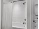 Bright white bathroom featuring a shower-tub combination with white tiled walls and modern fixtures at 208 Green Lake Dr., Myrtle Beach, SC 29572