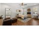 Comfortable bedroom with a metal bed frame, cozy rug, and a sitting area with a leather armchair at 208 Green Lake Dr., Myrtle Beach, SC 29572