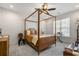 Inviting bedroom with a wooden canopy bed, neutral tones, and a cozy atmosphere at 208 Green Lake Dr., Myrtle Beach, SC 29572