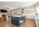 Spacious kitchen boasts a large island, hardwood floors, and seamless access to the cozy living area at 208 Green Lake Dr., Myrtle Beach, SC 29572