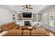 Inviting living room with built-in shelving, fireplace, and comfortable seating arrangement, perfect for relaxing at 208 Green Lake Dr., Myrtle Beach, SC 29572