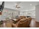 Open living room with plush seating, ceiling fan, and easy access to the kitchen and outdoor pool at 208 Green Lake Dr., Myrtle Beach, SC 29572
