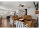 Cozy living room featuring hardwood floors, a fireplace, and opening to the kitchen with a navy-blue island at 208 Green Lake Dr., Myrtle Beach, SC 29572