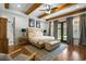 Serene main bedroom features exposed beams, hardwood floors, and private backyard access at 208 Green Lake Dr., Myrtle Beach, SC 29572