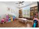 Bright playroom featuring a large window, custom built-in shelves, and a charming table with matching chairs at 208 Green Lake Dr., Myrtle Beach, SC 29572