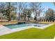 Lovely in-ground pool with water feature, patio, and lush landscaping at 208 Green Lake Dr., Myrtle Beach, SC 29572