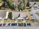A beautiful aerial view of a residential complex with ample parking and a scenic wooded backdrop at 220 Portsmith Dr. # 2, Myrtle Beach, SC 29588