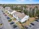 A lovely aerial view of the property showcasing the building's layout, parking, and adjacent green space at 220 Portsmith Dr. # 2, Myrtle Beach, SC 29588