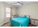 Bright bedroom featuring a large window, ceiling fan, and modern furnishings at 220 Portsmith Dr. # 2, Myrtle Beach, SC 29588