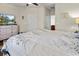 Spacious bedroom boasts a ceiling fan, door access, and an inviting space with a patterned duvet at 220 Portsmith Dr. # 2, Myrtle Beach, SC 29588