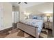 Charming bedroom features hardwood floors, a ceiling fan, and a well-lit space with neutral-colored walls at 220 Portsmith Dr. # 2, Myrtle Beach, SC 29588