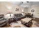 Living room with a comfortable grey leather sofa, coffee table, and decorative wall art at 220 Portsmith Dr. # 2, Myrtle Beach, SC 29588