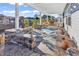 Relaxing outdoor patio area with stone accents and comfortable seating, showcasing a serene landscape at 223 Obi Lane, Surfside Beach, SC 29575