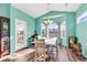 Bright dining area with white table and chairs, a chandelier, and lots of windows at 223 Obi Lane, Surfside Beach, SC 29575