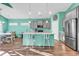 Bright and spacious kitchen featuring a center island with bar seating and stainless appliances at 223 Obi Lane, Surfside Beach, SC 29575