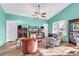 Cozy living room featuring hardwood floors, high ceilings, and bright turquoise walls at 223 Obi Lane, Surfside Beach, SC 29575