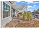 Inviting outdoor patio with comfortable seating overlooking a peaceful pond at 223 Obi Lane, Surfside Beach, SC 29575