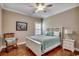 Bright bedroom with hardwood floors and a white wooden bed frame at 232 Wahee Pl., Conway, SC 29527