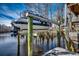 Boat lift on a river. Boat on lift is covered with a blue tarp at 232 Wahee Pl., Conway, SC 29527