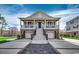 Charming two-story home with a front porch, two car garage and beautifully landscaped yard at 232 Wahee Pl., Conway, SC 29527