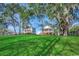 Beautiful waterfront homes with lush green lawn and mature trees creating a serene and picturesque setting at 232 Wahee Pl., Conway, SC 29527