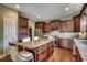 Spacious kitchen with dark wood cabinets, a large island, and stainless steel appliances at 232 Wahee Pl., Conway, SC 29527