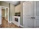 Laundry room with washer, dryer, storage cabinets, and an adjacent bath at 232 Wahee Pl., Conway, SC 29527