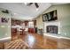 Bright living area with a kitchen view, a fireplace and hardwood floors at 232 Wahee Pl., Conway, SC 29527