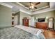 This spacious main bedroom has hardwood floors, a tray ceiling, and neutral paint at 232 Wahee Pl., Conway, SC 29527