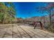 Expansive patio leading to a wooden walkway with lush foliage and waterfront views at 232 Wahee Pl., Conway, SC 29527