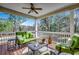View of the porch with green outdoor seating and a metal coffee table at 232 Wahee Pl., Conway, SC 29527