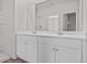 Bathroom featuring double sink vanity, large mirror, and shower-tub combination at 263 Warner Crossing Way, Loris, SC 29569