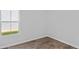 Sunny bedroom features a large window and hardwood flooring at 263 Warner Crossing Way, Loris, SC 29569