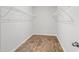 A walk-in closet with wire shelving and wood flooring adds to the home's storage space at 263 Warner Crossing Way, Loris, SC 29569
